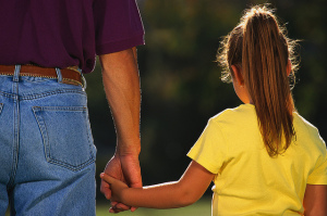 Father Holding Daughter's Hand